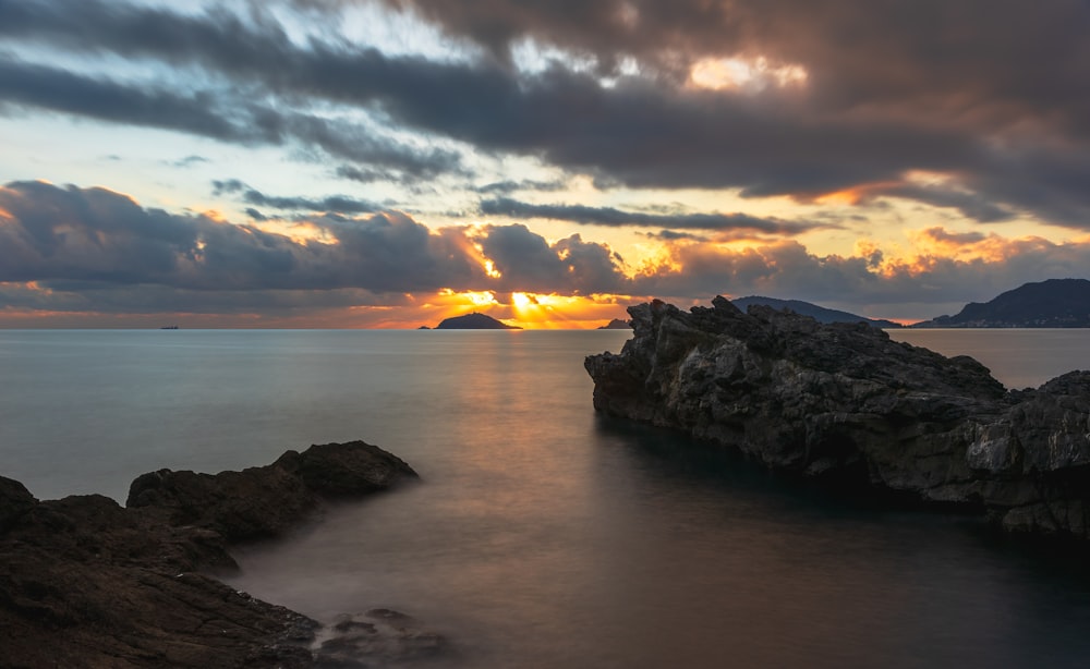 a sunset over a body of water