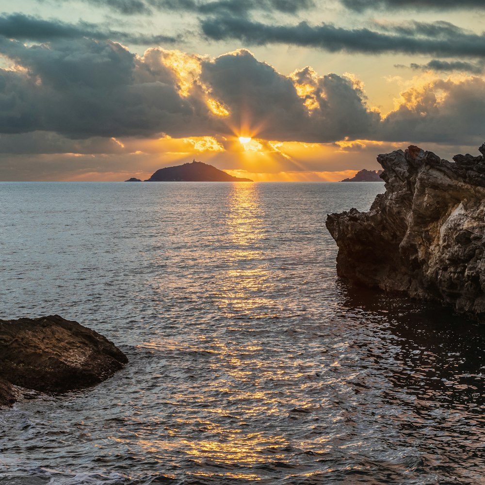 a sunset over a body of water