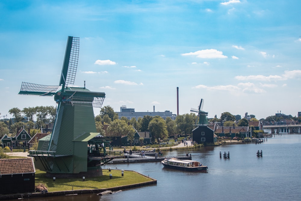 a river with a boat and buildings along it