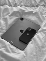 Responsive website layout displayed on a smartphone and tablet side by side.