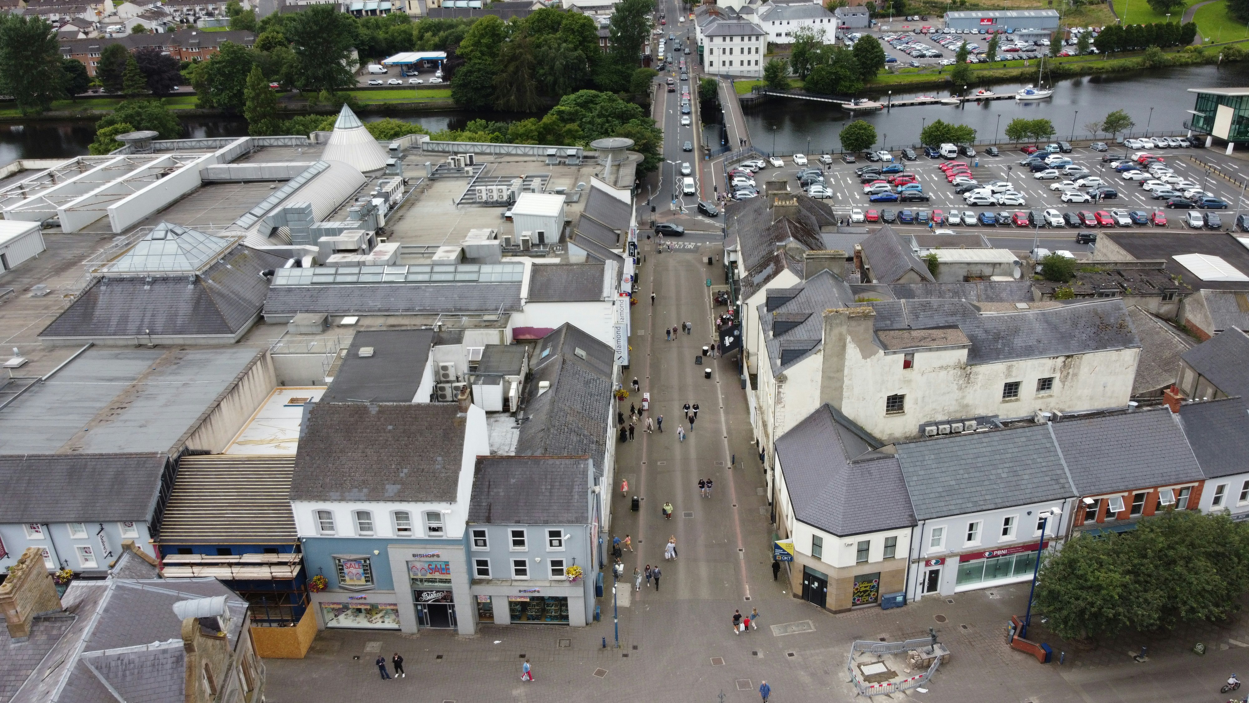 A city with many buildings and cars photo Free Coleraine town hall