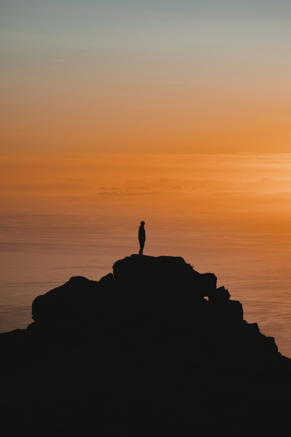 a person standing on a rock