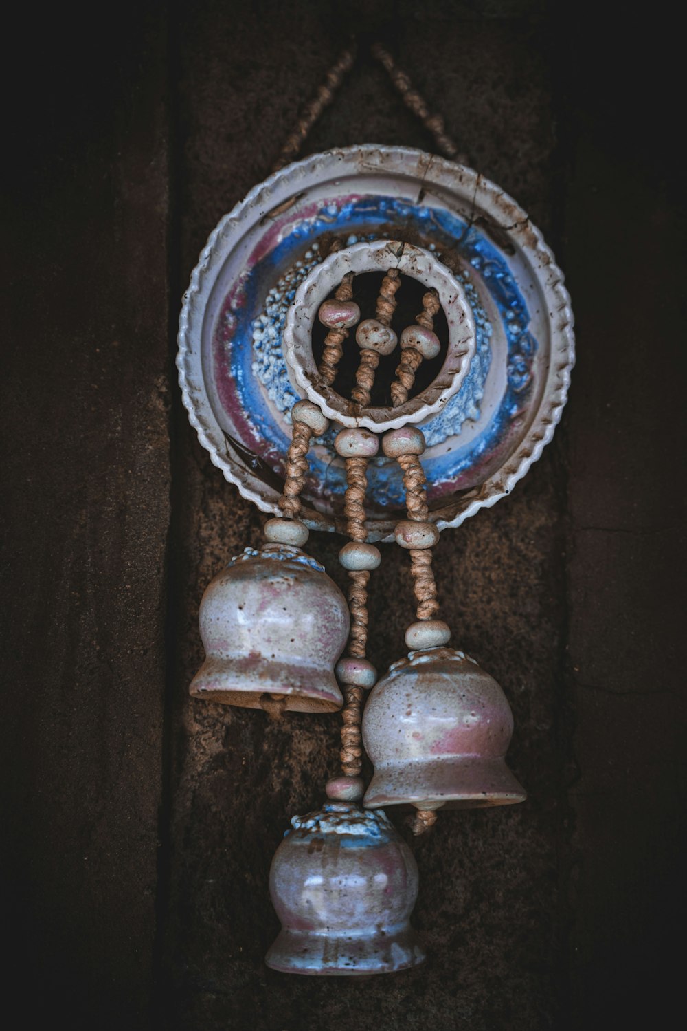 a glass vase with a skull and cross on it