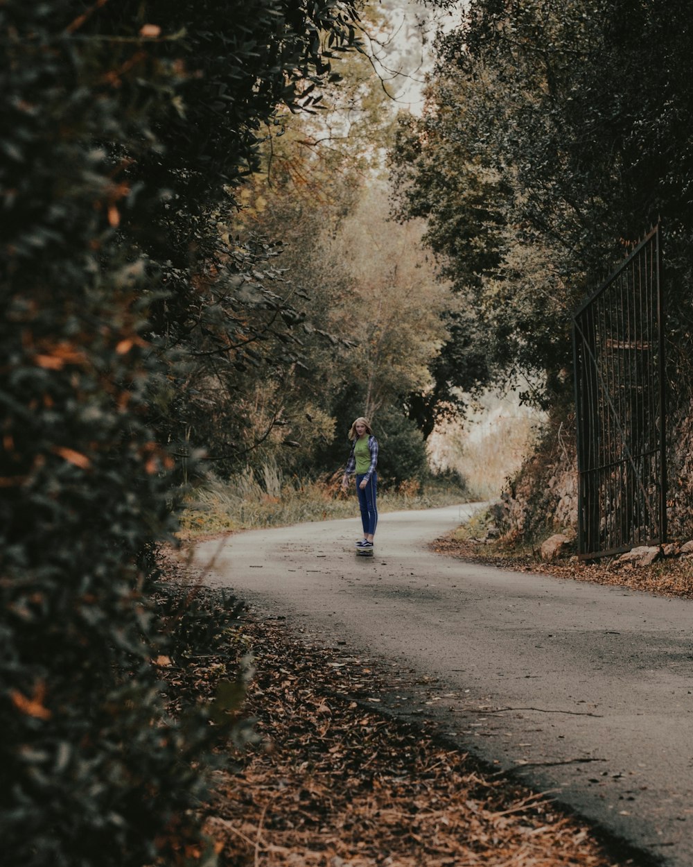 a person skateboards down a road