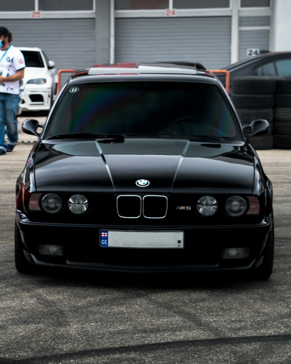 a black car parked in a parking lot