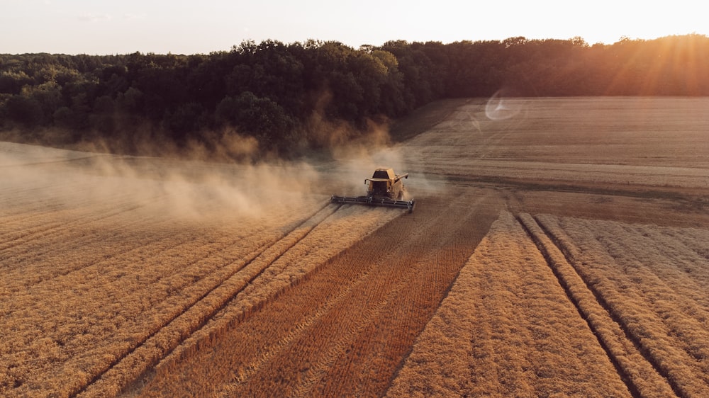 a tractor plowing a field