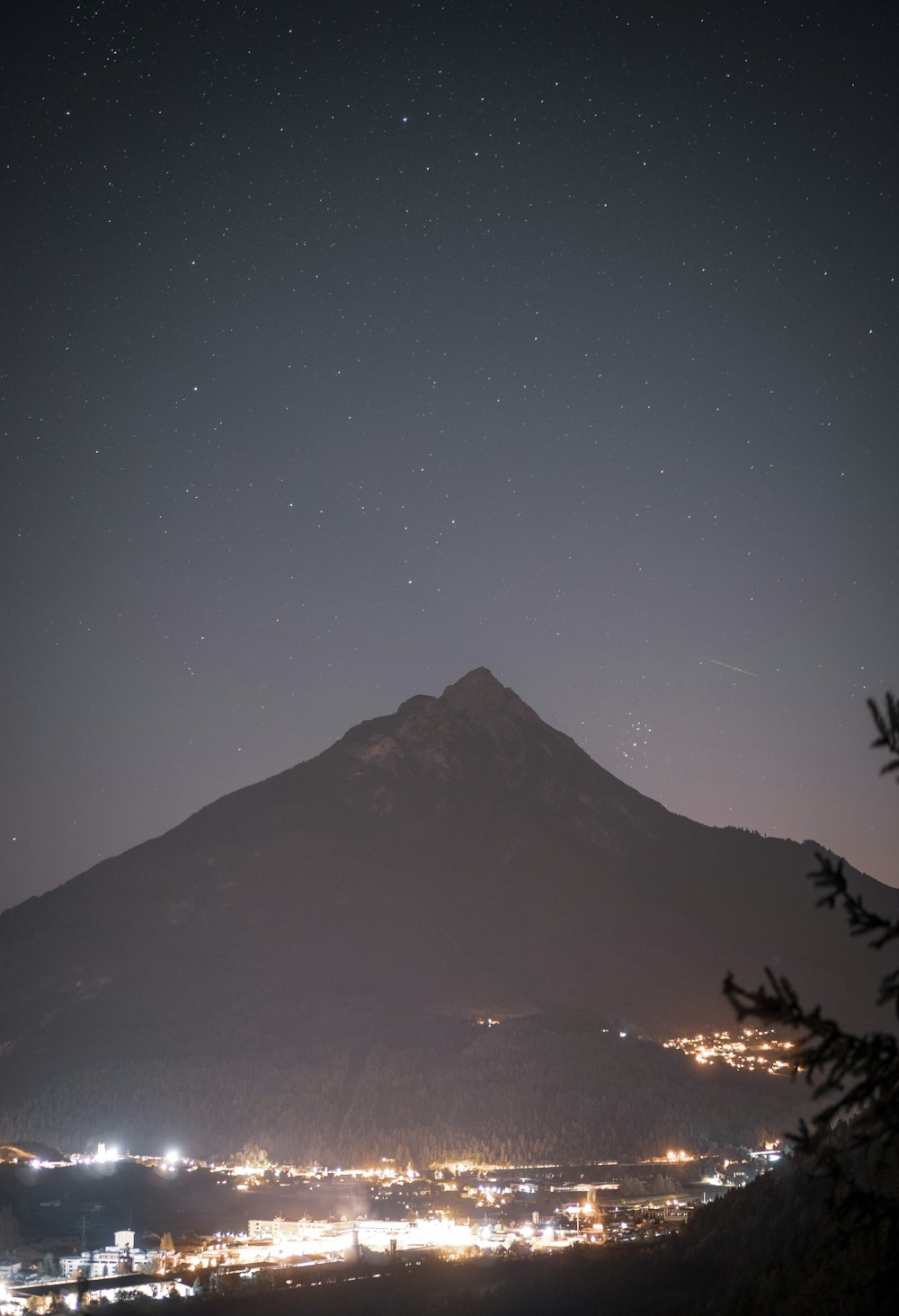 a mountain with lights at night