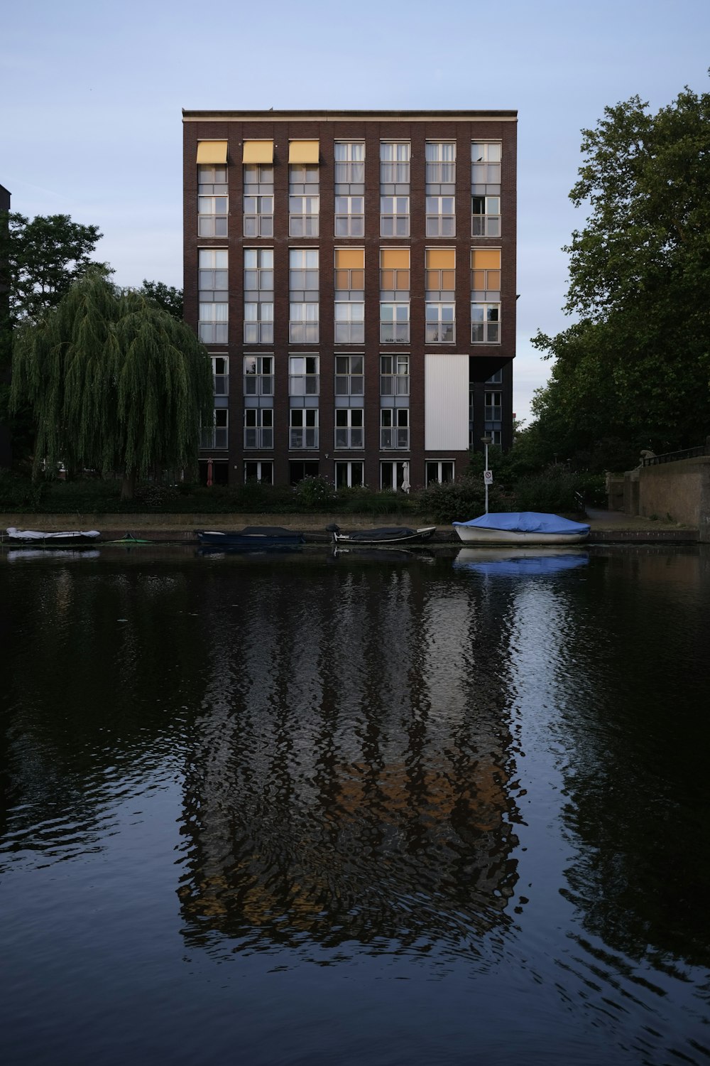 a building with a boat in the water