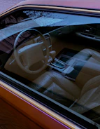 Interior of a car sparkling clean, highlighting the dashboard and seats.