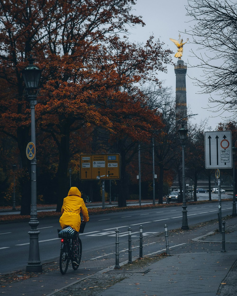 a person riding a bicycle on a street