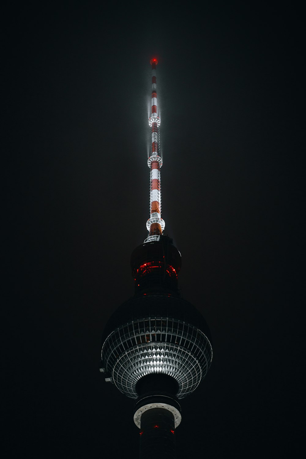 a tall tower with a red light