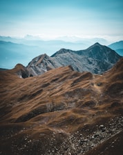a mountain range with clouds