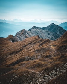 a mountain range with clouds