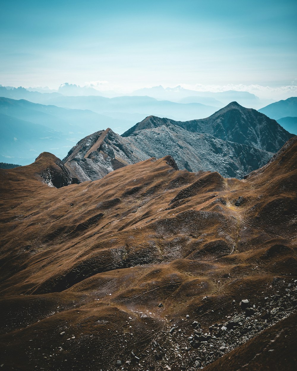 a mountain range with clouds