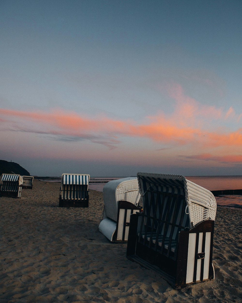 a group of chairs on a beach