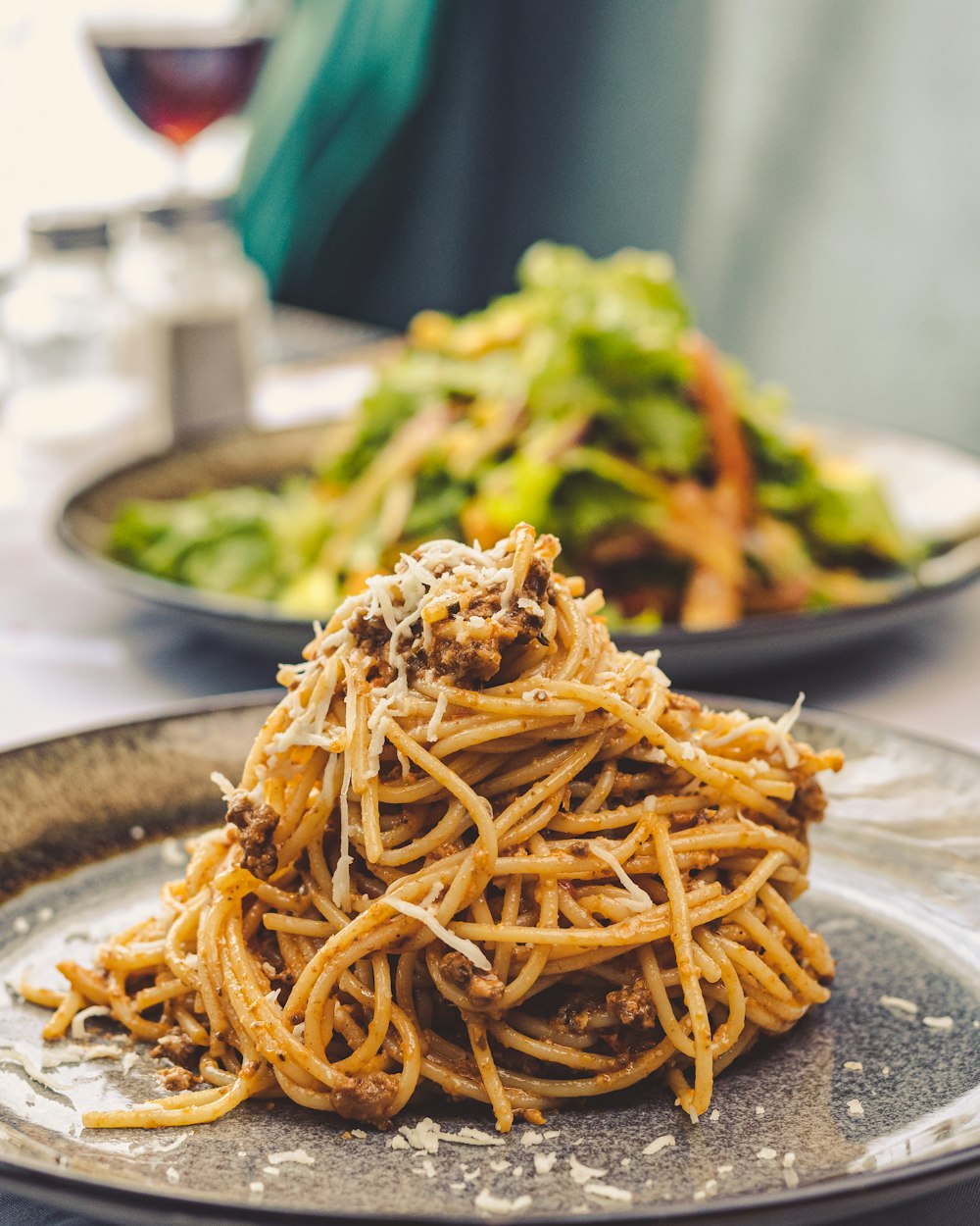 a plate of spaghetti and broccoli