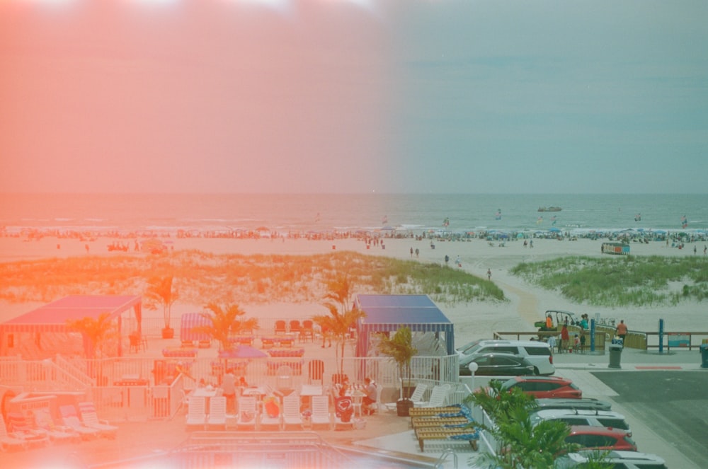 a beach with many cars parked on it