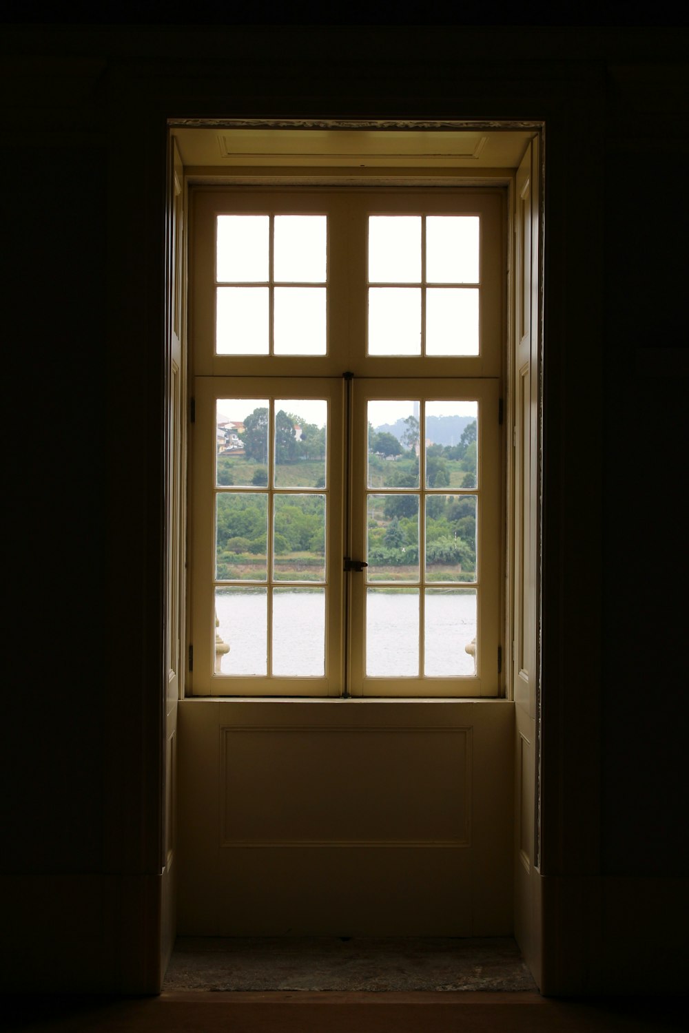 a window with a view of trees outside