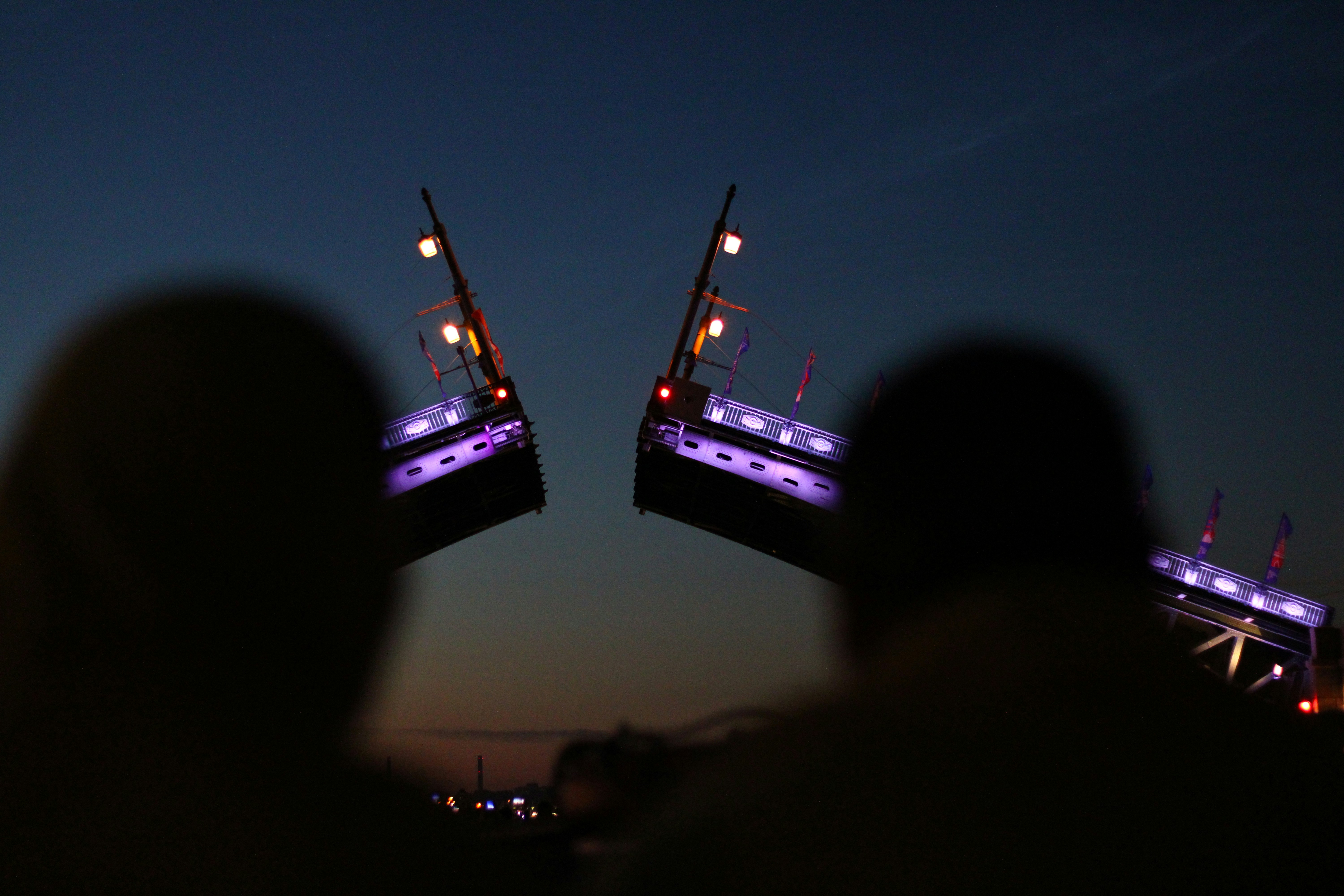 a group of people looking at a stage with lights