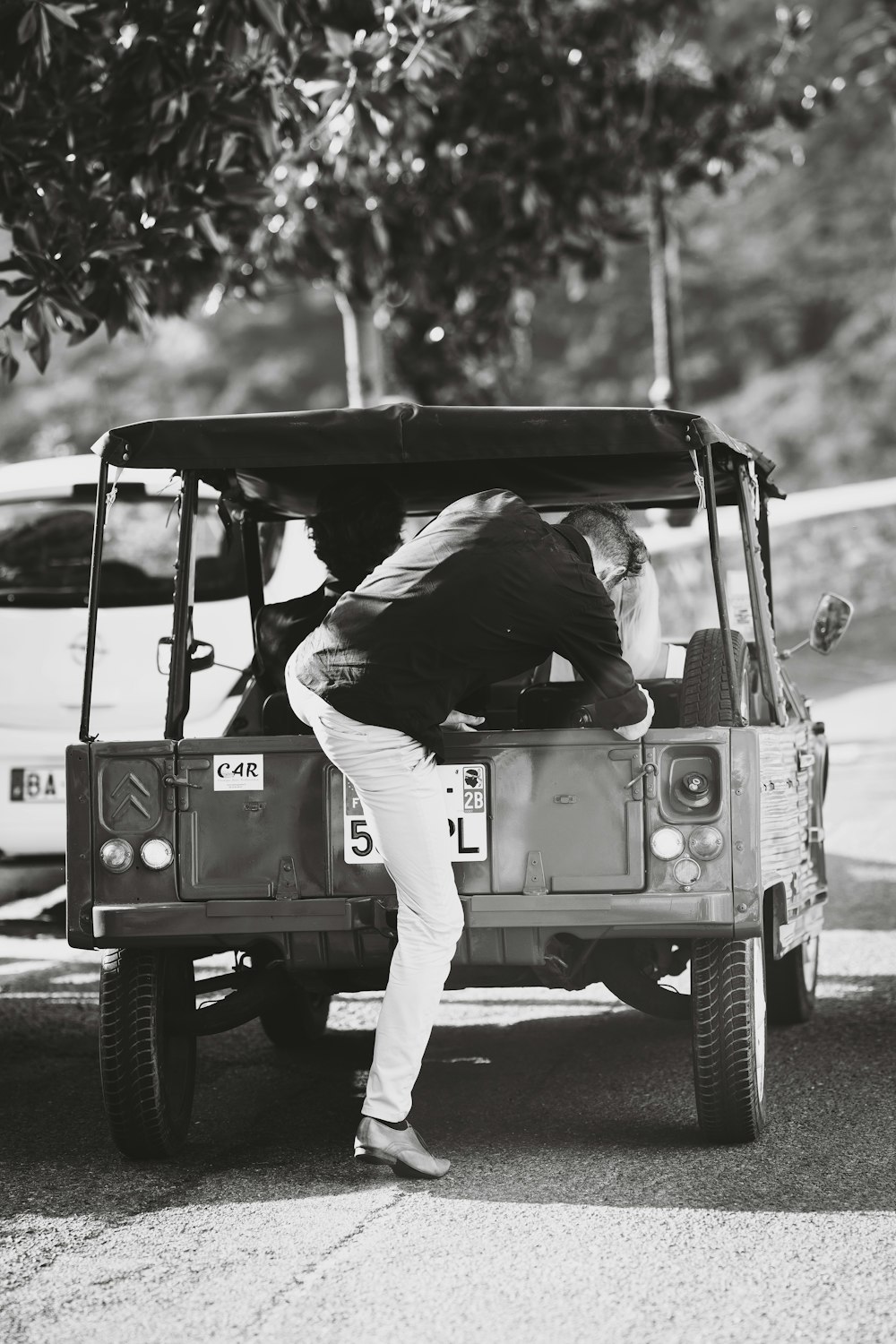 a man riding on the back of a truck