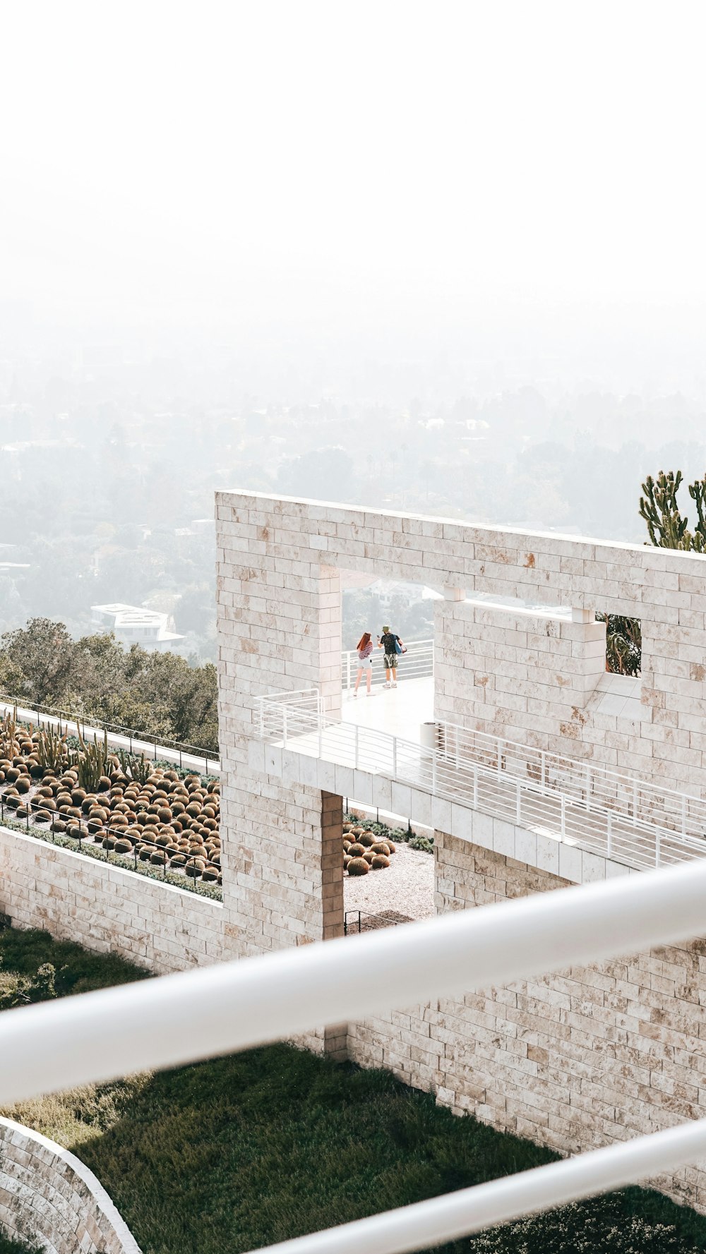 a group of people walking on a bridge