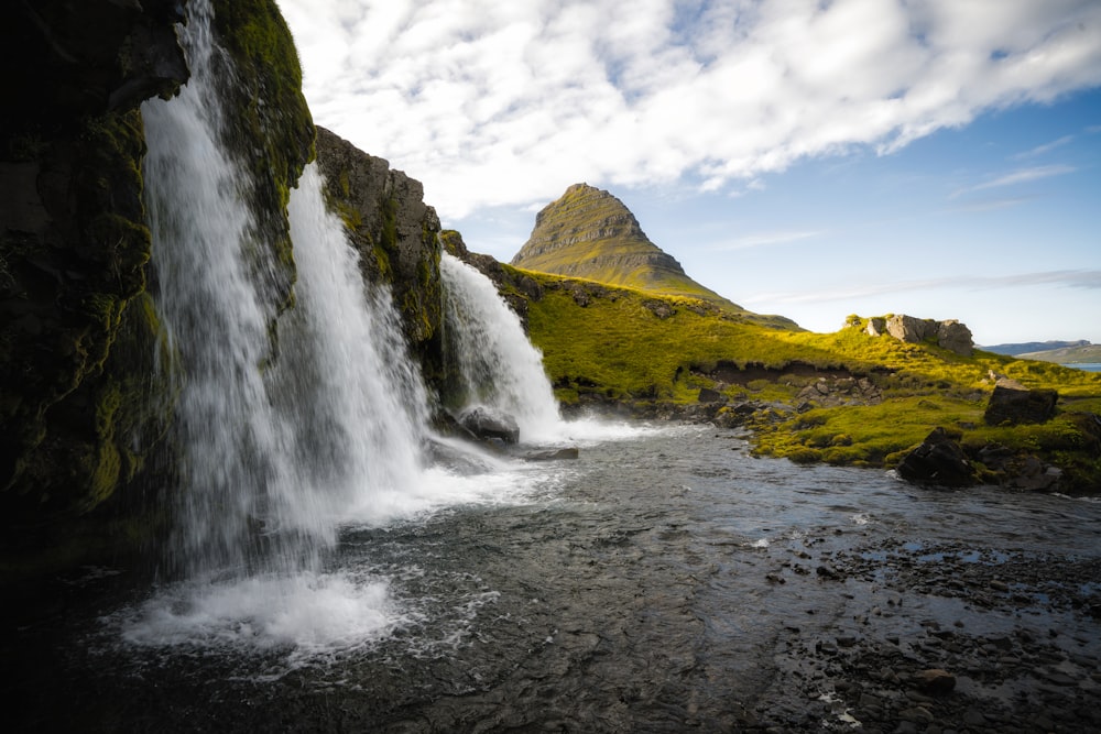 a waterfall with a rainbow