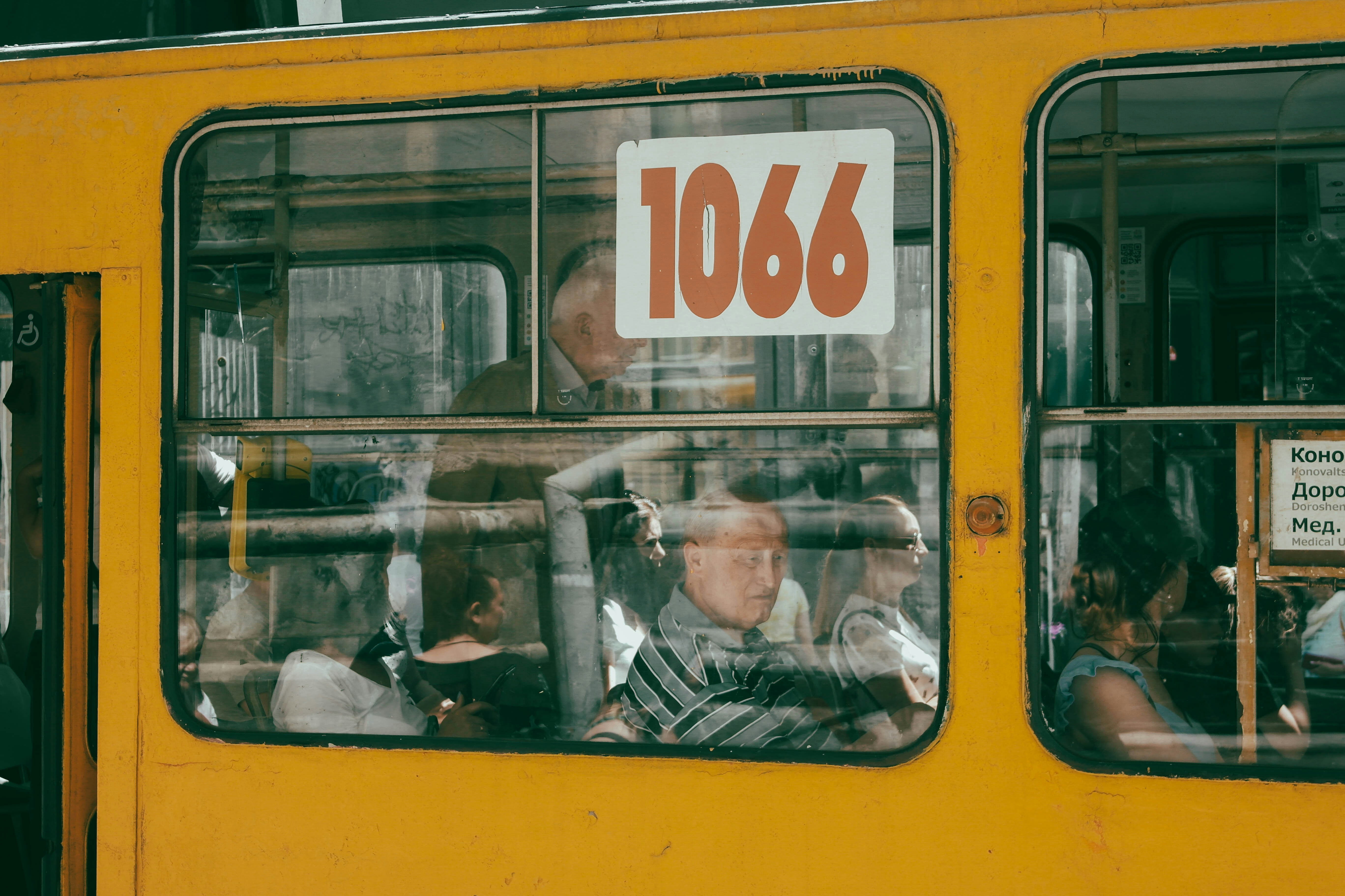 a group of people ride on a bus