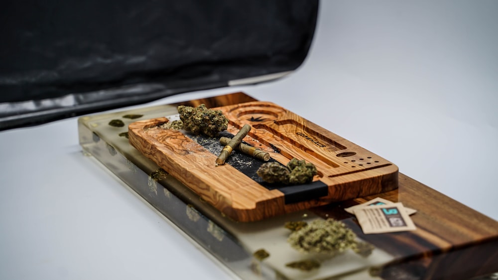 a wooden board with marijuana on it