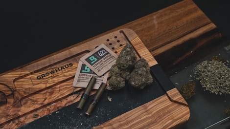 A variety of cannabis-infused edibles on a wooden table.