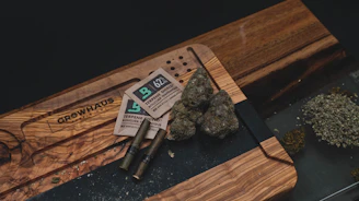 A cozy, inviting setup featuring a variety of cannabis products displayed on a rustic wooden table.