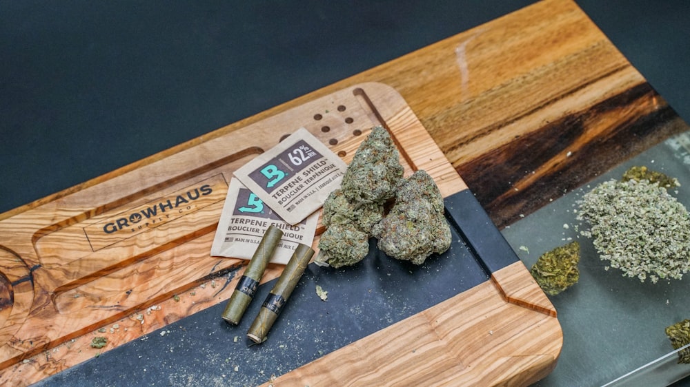a group of marijuana on a cutting board