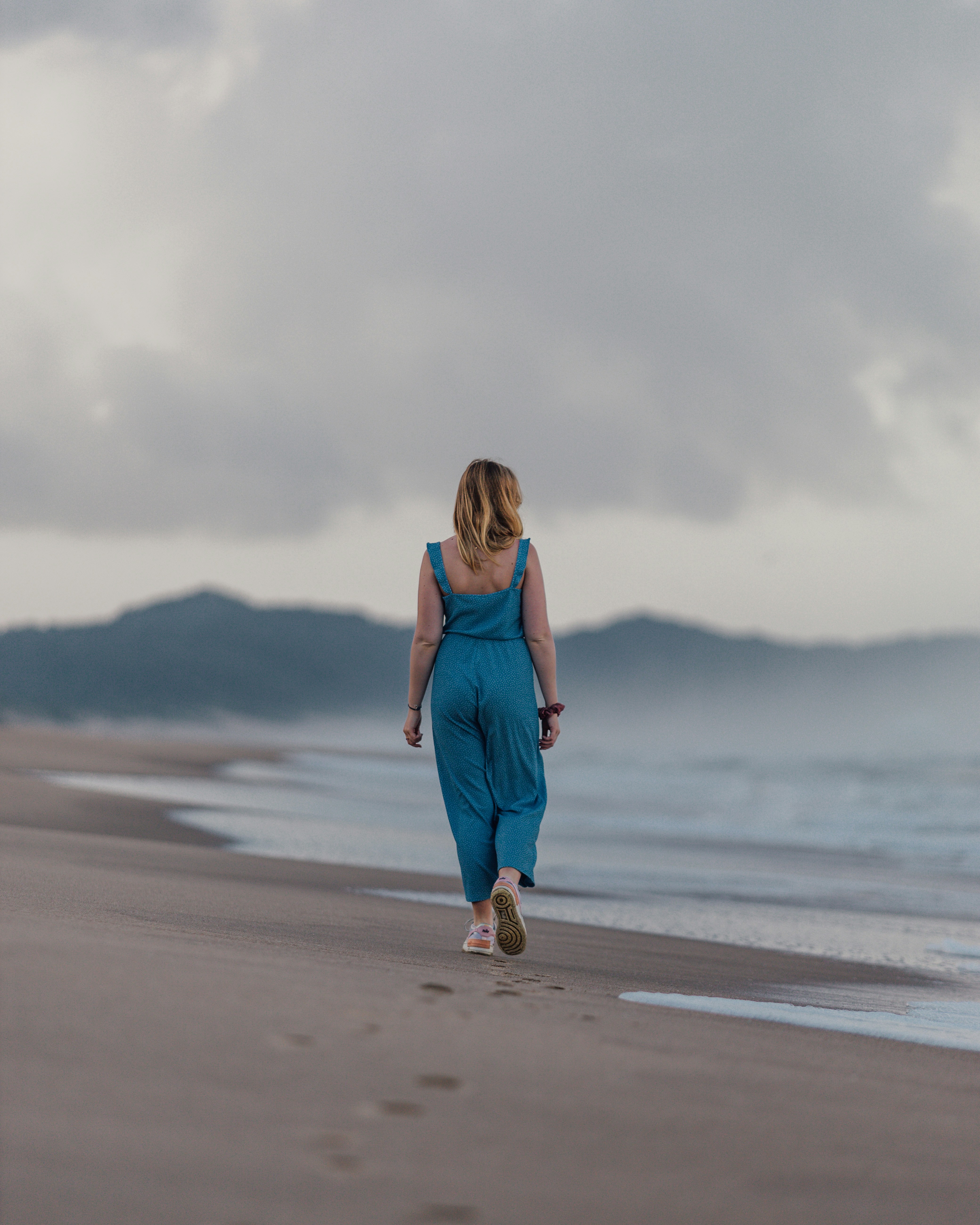 a person walking on a beach