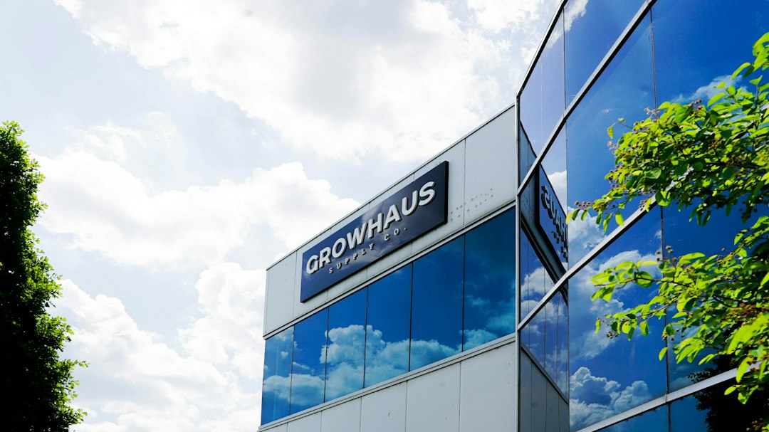a building with glass windows, GrowHaus Supply Co