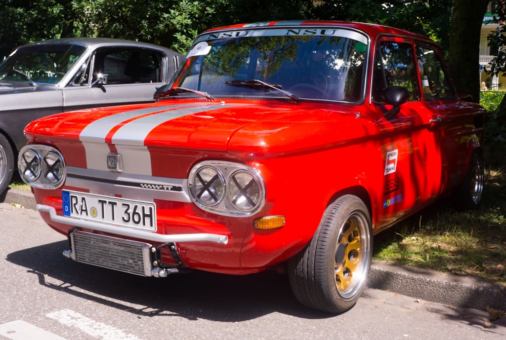 a red car parked on the side of the road