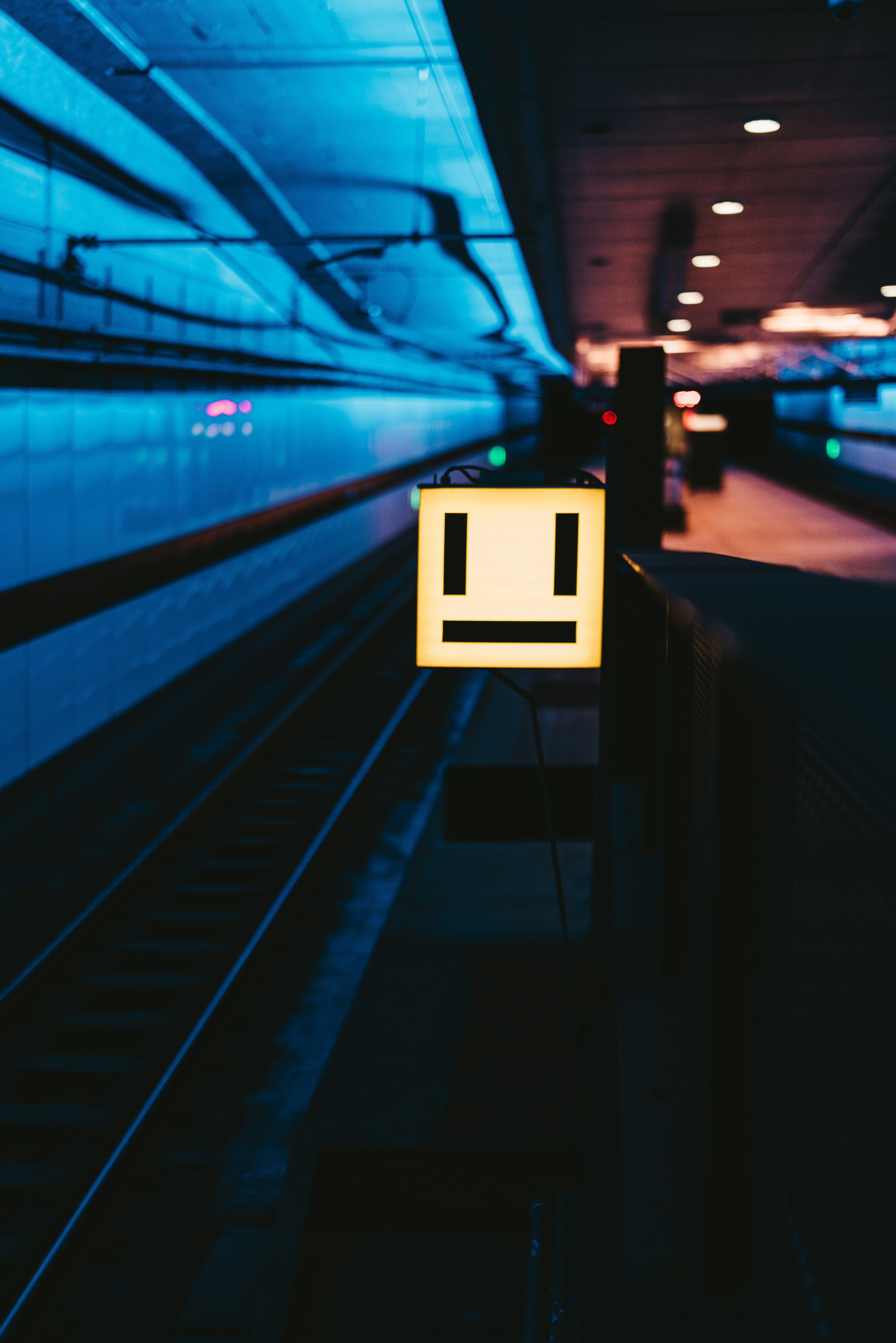 a sign on a train platform