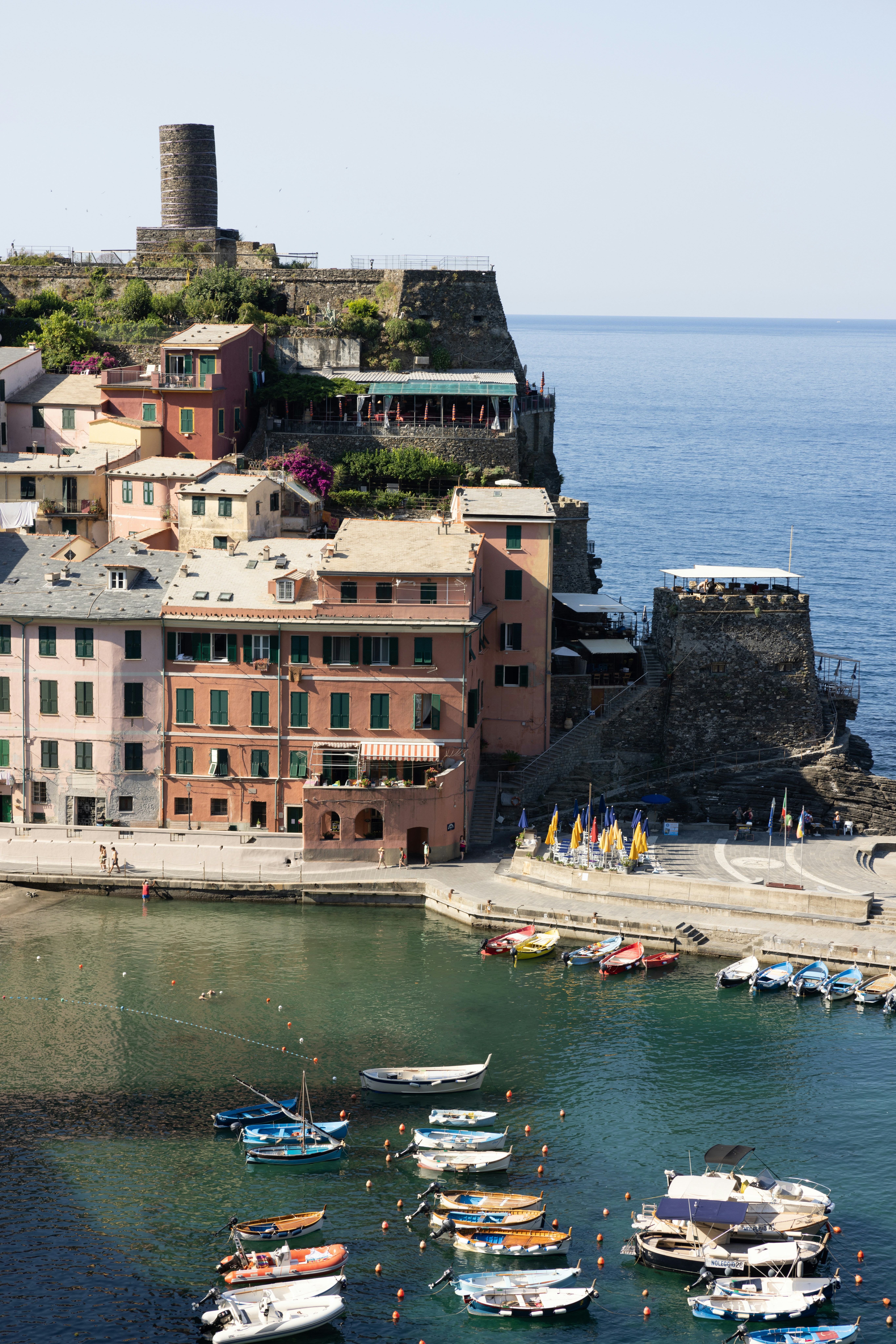 A body of water with boats in it and buildings around it photo Free