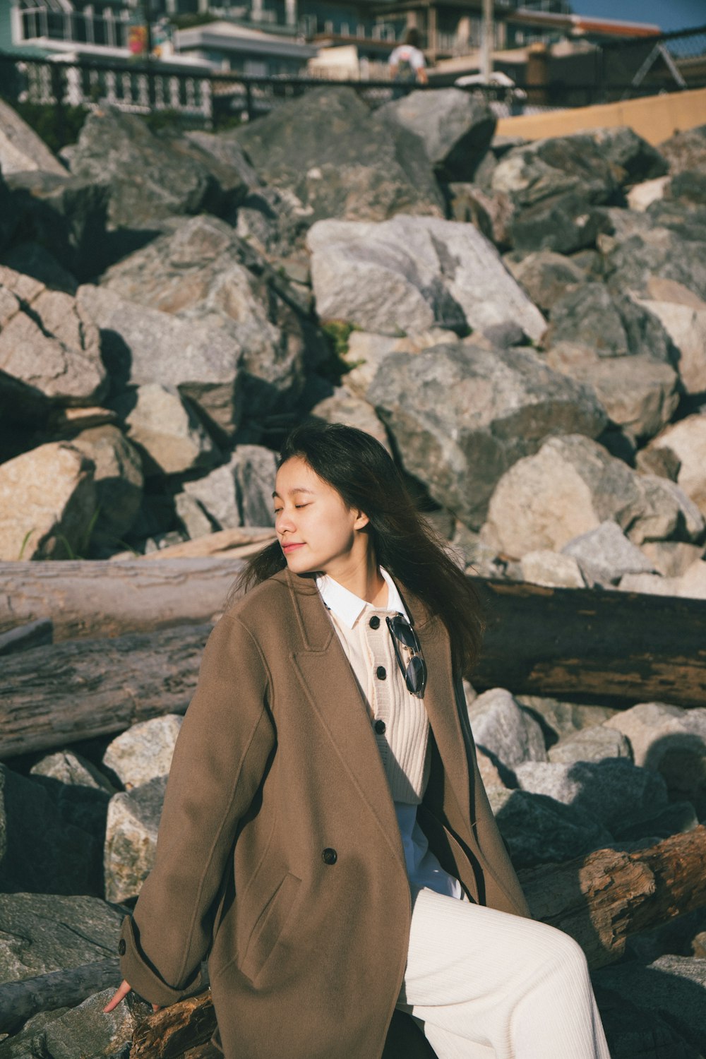 a person sitting on a rock