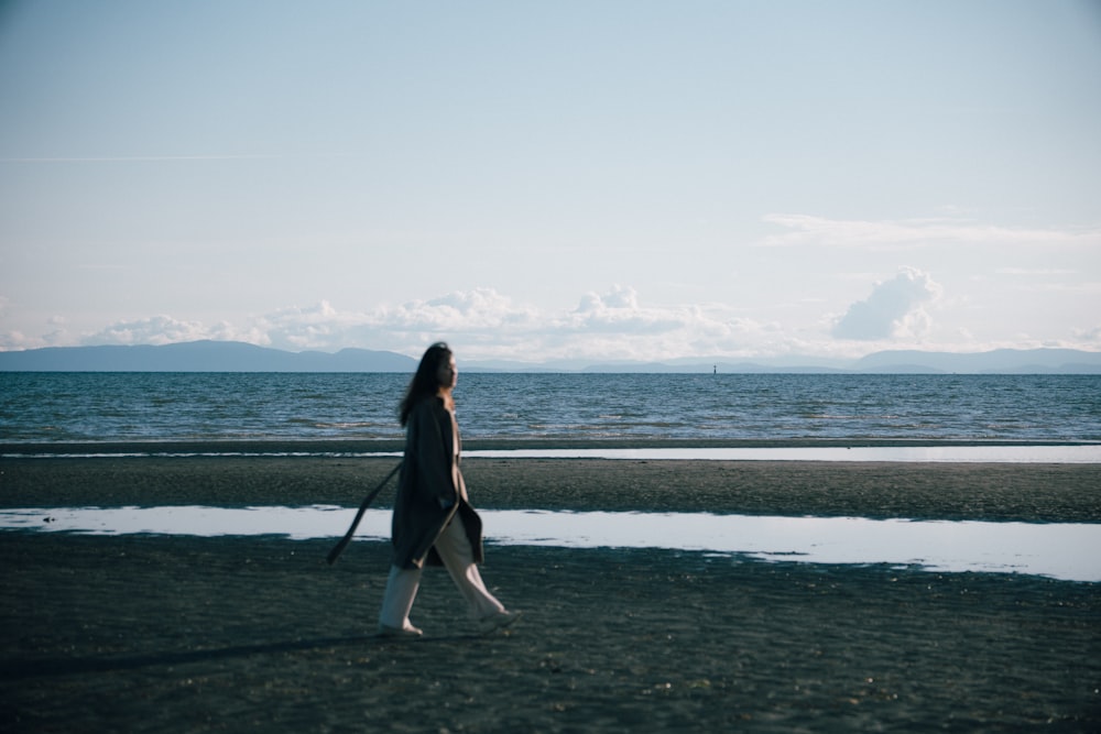 a person walking on a beach