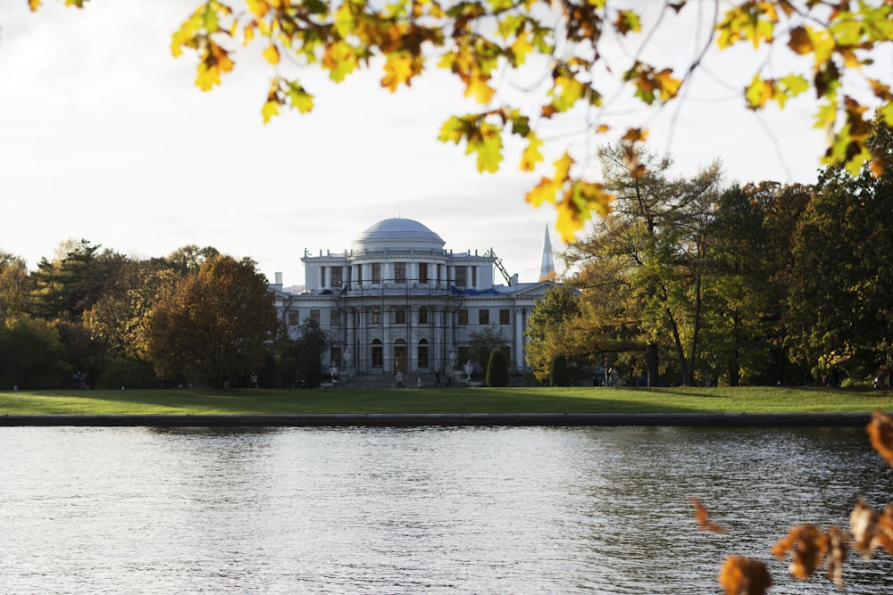 a building with a dome and trees around it