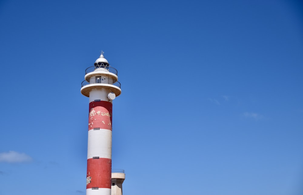 a lighthouse against a blue sky