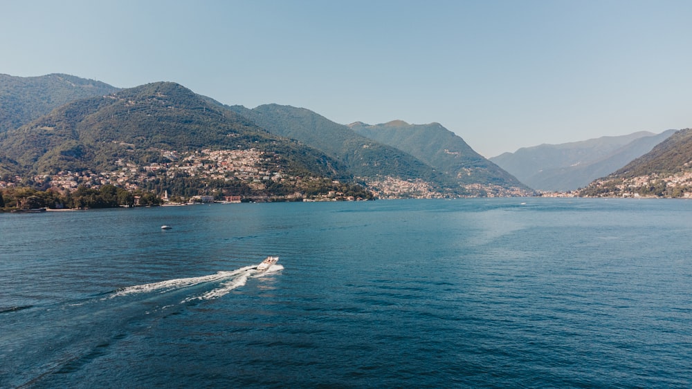 a body of water with a town in the distance