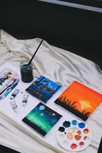a table with a book and a glass of water on it