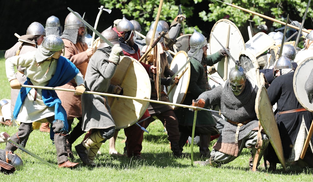 a group of people in armor holding swords