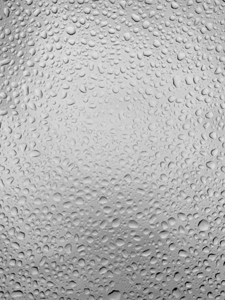 Close-up of a hydraulic seal with water droplets highlighting its precision and durability.