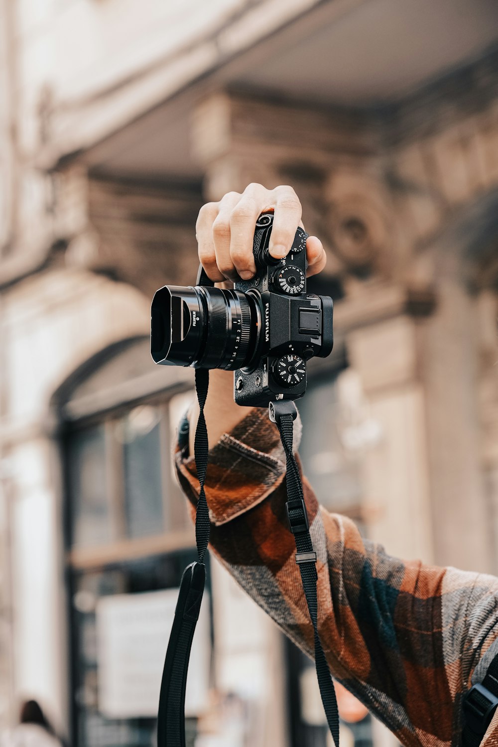 a person holding a camera