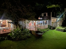 A cozy vacation rental with a welcoming porch and bright sunlight.