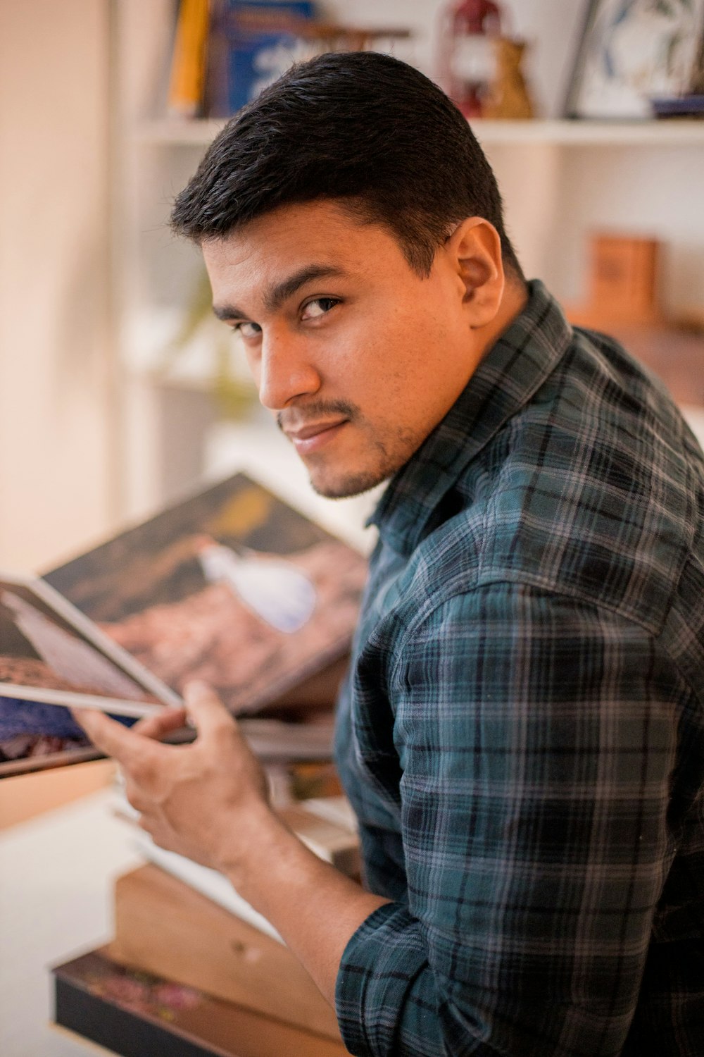 a man looking at a tablet