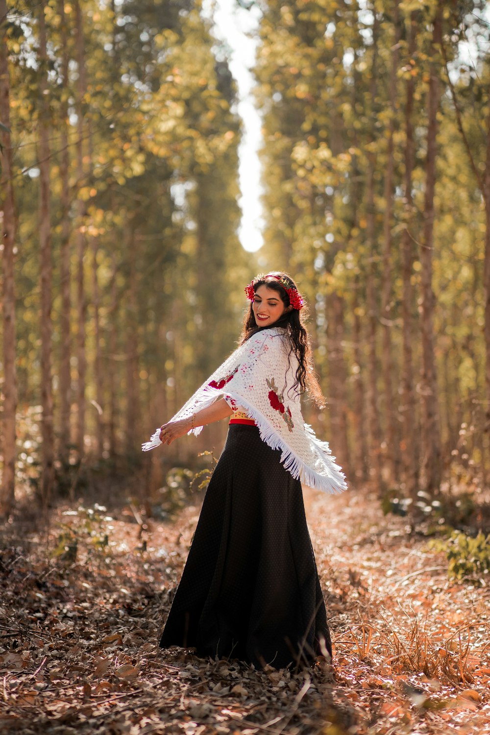 a person in a dress in a forest