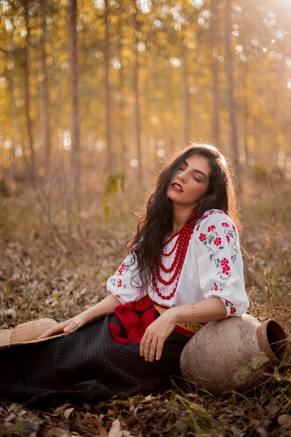 a person sitting on a log in a forest