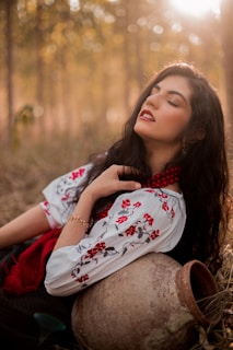 a woman sitting on a deer